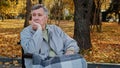 Mature outdoors upset senior retired caucasian man grandfather pensioner sitting alone in wheelchair depressed pensive Royalty Free Stock Photo