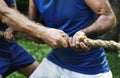 Mature people in tug of war