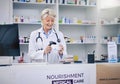 Mature pharmacist, woman and scanning pills, cashier with medicine and pharmacy, digital and stock barcode Royalty Free Stock Photo