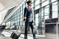 Mature pilot walking to enter the plane in boarding gate at airport