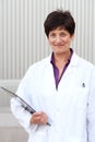 Mature professional woman dressed in labcoat Royalty Free Stock Photo
