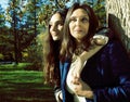 Mature real mother with daughter outside autumn fall in park