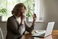 Mature 60s pensioner tired of using laptop at home