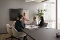 Mature senior business leader woman talking to group of colleagues Royalty Free Stock Photo