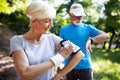 Mature or senior couple doing sport outdoors, jogging in a park Royalty Free Stock Photo