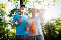 Mature or senior couple doing sport outdoors, jogging in a park Royalty Free Stock Photo