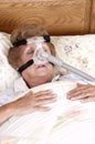 Mature Senior Woman CPAP Sleep Apnea Machine