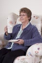 Mature Senior Woman Entertaining Drinking Coffee