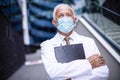 Serious doctor on street wearing protective mask Royalty Free Stock Photo