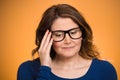 Mature, shy, sad woman playing nervously with glasses Royalty Free Stock Photo