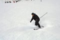 Mature skier fallen during downhill at ski resort in winter. Accident at ski slope due to unfasten ski binding. Extreme winter Royalty Free Stock Photo