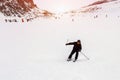 Mature skier fallen during downhill at ski resort in winter. Accident at ski slope due to unfasten ski binding. Extreme winter Royalty Free Stock Photo