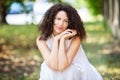 Mature Spanish Woman Smiling At The Camera. She is outside at the park. So sweet and romantic Royalty Free Stock Photo