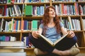 Mature student reading book in library Royalty Free Stock Photo