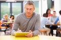 Mature Student Studying In Classroom With Digital Tablet Royalty Free Stock Photo