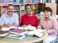 Mature students studying in library Royalty Free Stock Photo