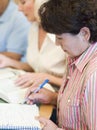 Mature students studying in library