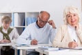 Mature students writing an exam Royalty Free Stock Photo