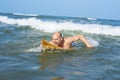 Mature surfer ready to catch a wave