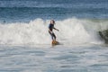 Mature surfer rides shore break California
