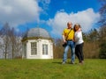 Mature tourist couple, a Mexican woman and a Dutch man with the Tea dome or Theekoepel or Gloriette in the background Royalty Free Stock Photo