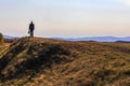 mature tourist traveling along the Nurali ridge in the Ural mountains on an autumn sunny day