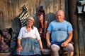 Mature villagers resting on a wooden bench Royalty Free Stock Photo