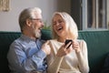 Mature wife and husband, family having fun together, using phone Royalty Free Stock Photo