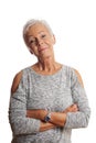 Mature woman with arms folded and head tilted