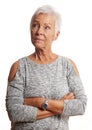 Mature woman with arms folded looking away