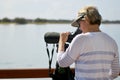 Mature woman birdwatching Royalty Free Stock Photo