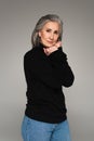 Mature woman in black jumper and