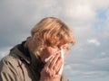 Mature Woman Blowing Nose