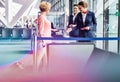 Mature woman on board scanning her ticket on smartphone in airport