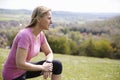 Mature Woman Checking Activity Tracker Whilst On Run Royalty Free Stock Photo