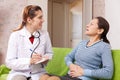 Mature woman complaining to doctor