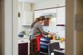 Mature Woman Cooking at Home