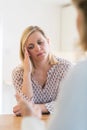 Mature Woman Discussing Problems With Counselor Royalty Free Stock Photo