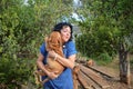 Mature woman dog breeder checks her Boerboel stock