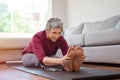 Mature woman doing yoga exercise at home Royalty Free Stock Photo