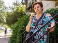 Mature woman eating ice cream Royalty Free Stock Photo