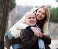 Mature woman and elderly man posing together Royalty Free Stock Photo