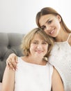 Mature woman embrace with young girl Royalty Free Stock Photo