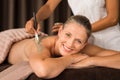 Mature woman enjoying mud massage Royalty Free Stock Photo