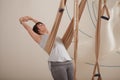 Mature woman practicing aerial yoga Royalty Free Stock Photo