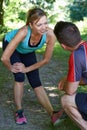 Mature Woman Exercising With Personal Trainer In Park Royalty Free Stock Photo