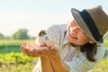 Mature woman farmer holding newborn chick in her hand Royalty Free Stock Photo