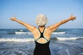 Mature woman feeling free at the beach Royalty Free Stock Photo