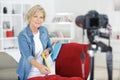 Mature woman filming craft blog