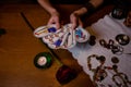 He fortuneteller holds several cards.